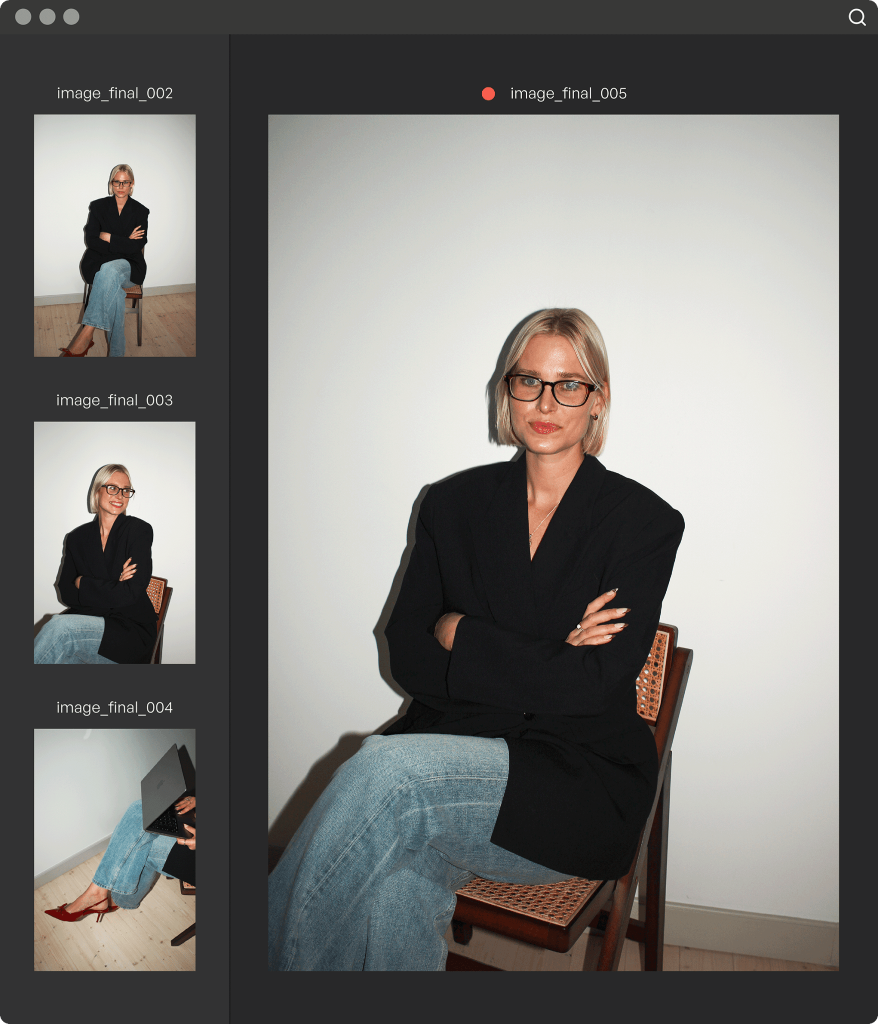 Blonde scandinavian woman in a suit sitting on a rotting wood chair